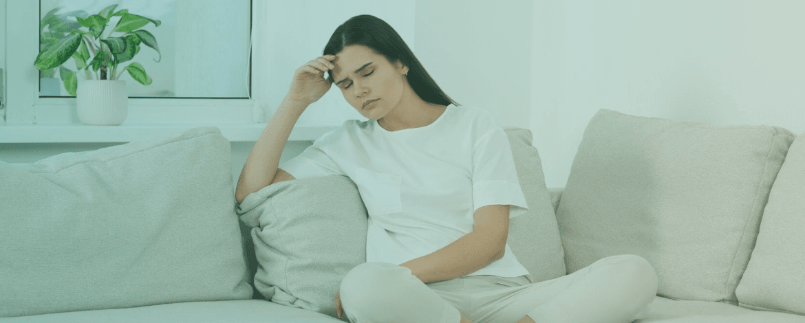 Mature woman smiling confidently outdoors, representing vitality during menopause.